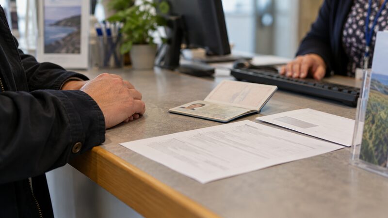 A membership application form and the identity documents a credit union asks for
