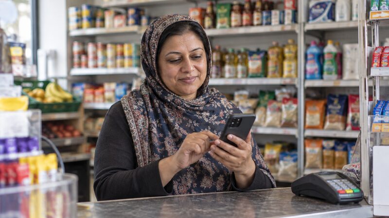 A member using the Advance Credit Union mobile app to check savings and request a withdrawal