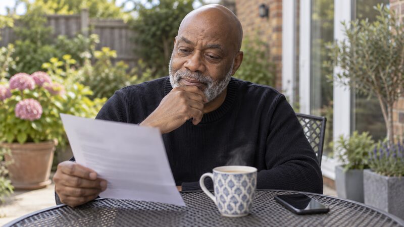 A saver checking a fixed term deposit maturity notice and deciding what to do with the balance